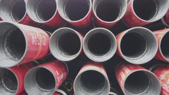 Oil well casing bundles stacked on the deck of a drilling rig