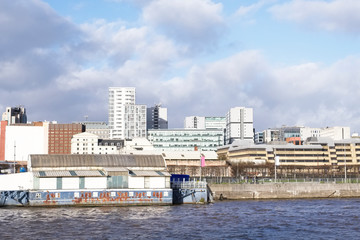 City skyline high office skyscraper buildings and sea water on coastal city