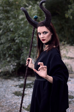 Wicked Maleficent without wings with a staff. Malesessy photo session.