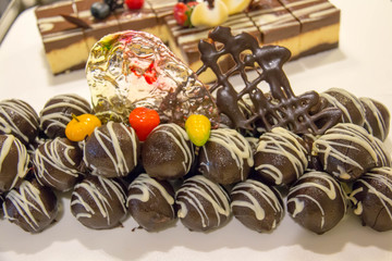 A delicious dark chocolate ball closeup background