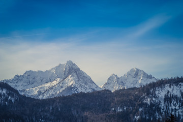 Fototapeta na wymiar Panoramic view of the European Alps, dark, cloudy background concept