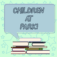 Handwriting text writing Children At Park. Concept meaning place specifically designed to enable children play there Uneven Pile of Hardbound Books and Blank Rectangular Color Speech Bubble