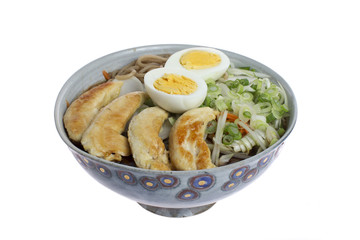 Ramen with chicken, eggs, vegetables and noodles on a white background