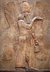 Assyrian wall relief of a winged genius