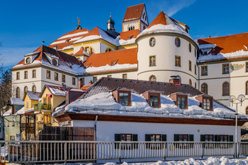 St. Mang's Abbey (Kloster Sankt Mang) at winter in the snowy historic old town of Füssen, a romantic medieval city on the Romantic Road in Bavaria, Germany