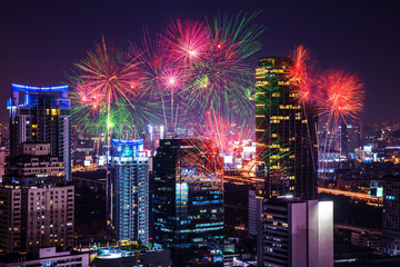 The colorful fireworks on cityscape in the night as beautiful background concept