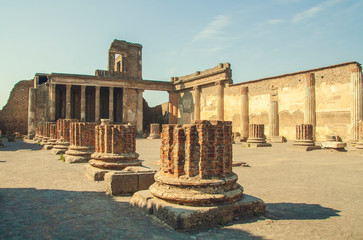 Ruins of antique roman temple in Pompeii near volcano Vizuvius, Naples, Italy. Archaeological ruin...