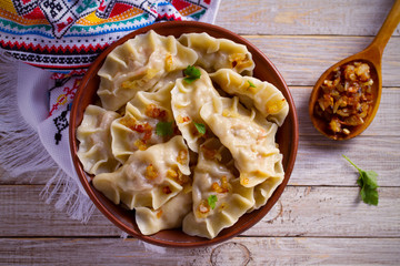 Dumplings, filled with cabbage. Varenyky, vareniki, pierogi, pyrohy - dumplings with filling. ...