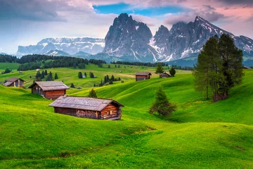 Papier Peint photo Dolomites Seiser Alm resort and wooden chalets at sunset, Dolomites, Italy