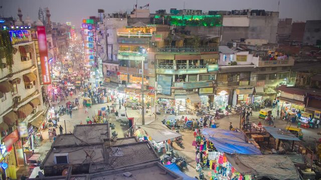 View to crowded street with shops, hotels, transport and people in Main Bazaar or Paharganj. Timelapse.