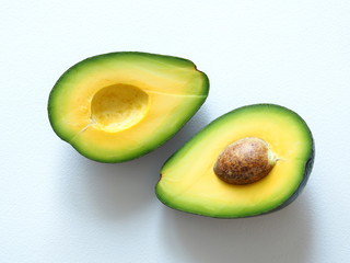 sliced avocado on white background