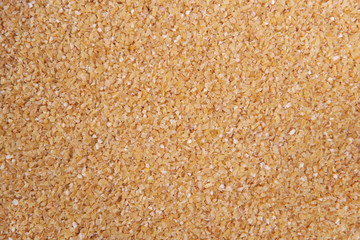 Wheat groats. Top view. Food Background. A scattering of wheat groats. Healthy food. Natural food.