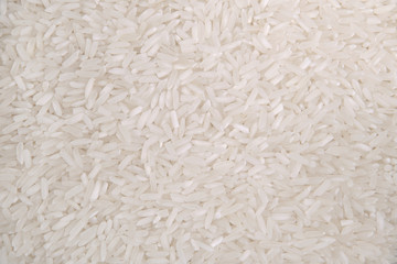 Rice grains. Top view. Food Background. A scattering of rice grains. Healthy food. Natural food.