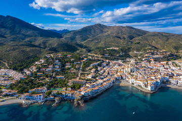 Fototapeta na wymiar Aerial view of Cadaques Spain. Sea, mountains and beautiful city with white houses. Drone photo