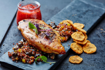 chicken breast with quinoa,black beans and banana chips and chili sauce