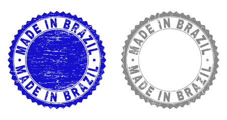 Grunge MADE IN BRAZIL stamp seals isolated on a white background. Rosette seals with grunge texture in blue and grey colors. Vector rubber stamp imitation of MADE IN BRAZIL text inside round rosette.