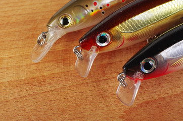 Fishing wobblers on a wooden table