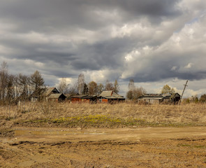Cloudy day in early spring. Abandoned farm buildings. Russia. Leningrad region.