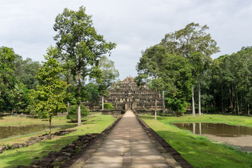 Fototapeta na wymiar Path leading to a temple at Angkor archaeological site