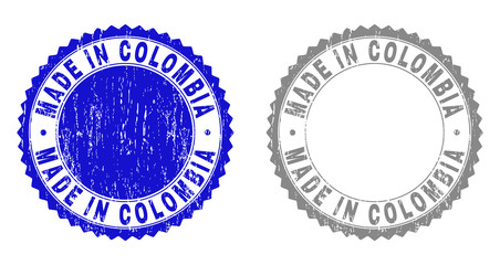 Grunge MADE IN COLOMBIA stamp seals isolated on a white background. Rosette seals with grunge texture in blue and grey colors.