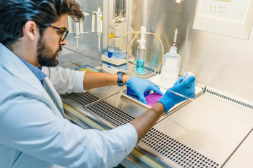 In a Modern Laboratory Scientist Conducts Experiments by Synthesizing Compounds with use of Dropper