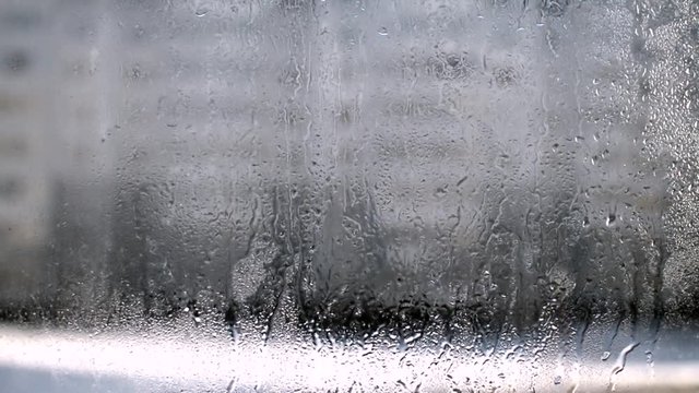 raindrops run down the window
