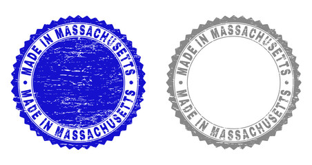 Grunge MADE IN MASSACHUSETTS stamp seals isolated on a white background. Rosette seals with distress texture in blue and grey colors.