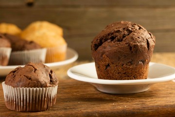 Chocolate cake and nut cake, homemade cakes on wooden background
