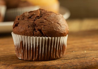 Chocolate cake and nut cake, homemade cakes on wooden background