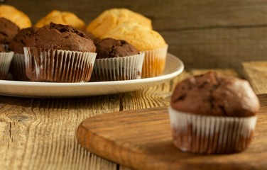 Chocolate cake and nut cake, homemade cakes on wooden background