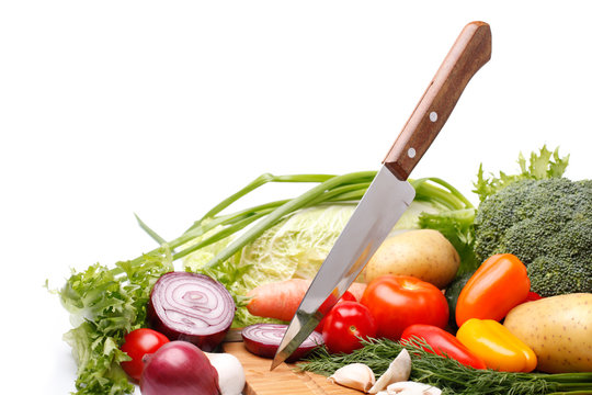 Fresh vegetables with knife