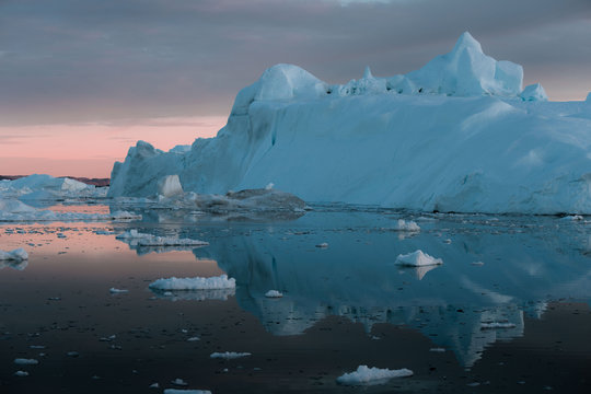 Floating Iceberg in Greenland during sunset