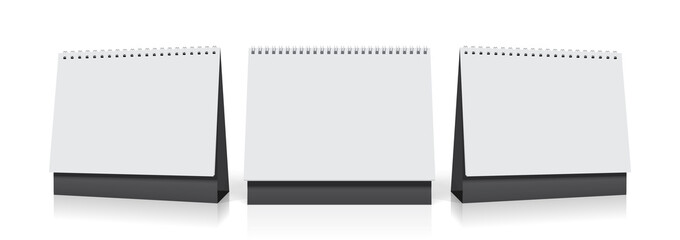 white paper calendar stands on the table