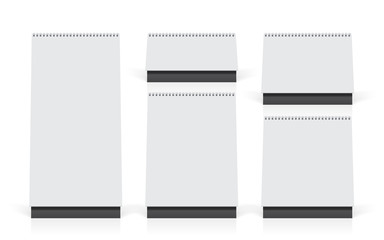 white paper calendar stands on the table