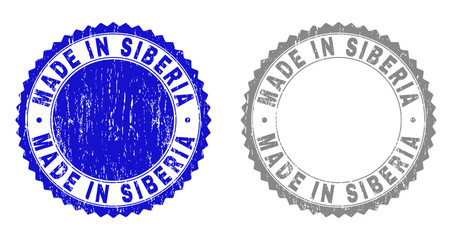 Grunge MADE IN SIBERIA stamp seals isolated on a white background. Rosette seals with grunge texture in blue and grey colors. Vector rubber watermark of MADE IN SIBERIA label inside round rosette.