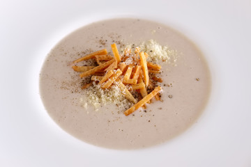 Mushroom soup puree with bacon flakes