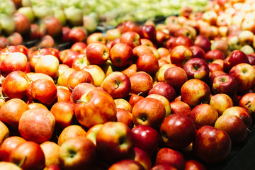 Red apples on a display in a supermarket in bulk