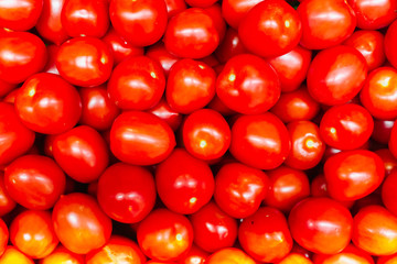 Red tomatoes on a display in a supermarket in bulk