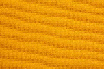 Closeup of seamless Orange knitted fabric texture. Cloth knitted background.