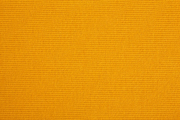 Closeup of seamless Orange knitted fabric texture. Cloth knitted background.