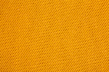 Closeup of seamless Orange knitted fabric texture. Cloth knitted background.