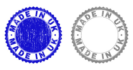 Grunge MADE IN UK stamp seals isolated on a white background. Rosette seals with distress texture in blue and gray colors. Vector rubber stamp imprint of MADE IN UK text inside round rosette.