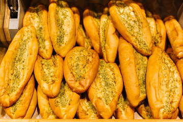 Bread Shop. Fresh tasty bread are on the shelves. Variety of delicious breads displayed on shelves in bakery