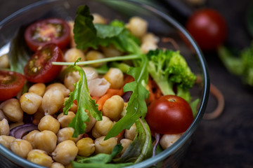 Healthy homemade chickpea and veggies salad, diet, vegetarian, vegan food  put on wooden background