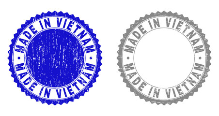 Grunge MADE IN VIETNAM stamp seals isolated on a white background. Rosette seals with distress texture in blue and gray colors.
