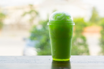 Fresh kiwi juice soda on wood table