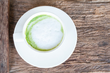 hot Matcha green tea latte beverage in table