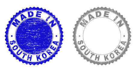 Grunge MADE IN SOUTH KOREA stamp seals isolated on a white background. Rosette seals with grunge texture in blue and gray colors.