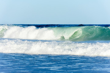 Ocean waves and blue sky background