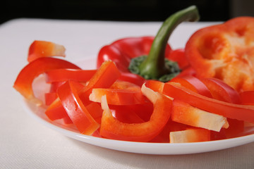Red pepper on a plate. Fresh and tasty. Spice, vegetable, cooking.